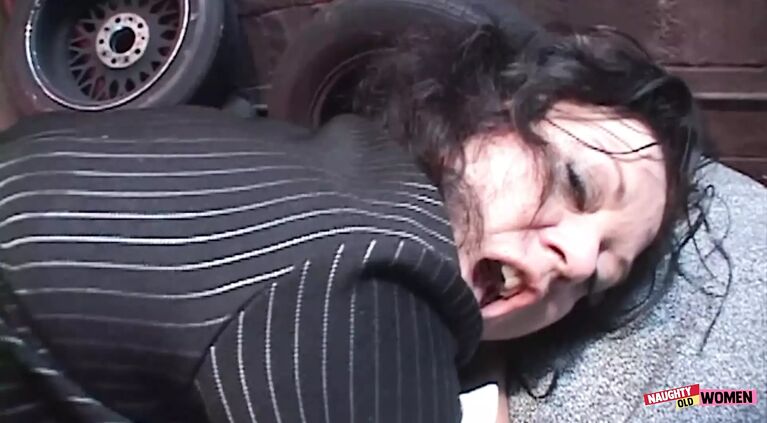 An entire gang of strong black guys surround a brunette MILF and fuck her raw